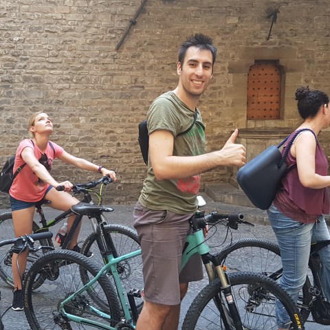 Group of people standing on the bikes