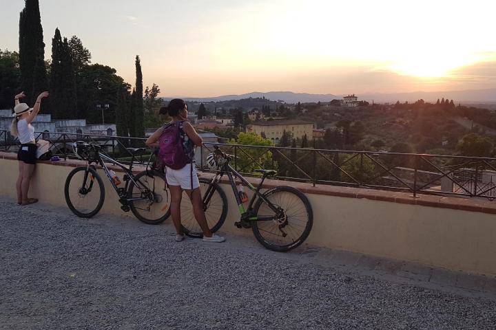 Two girls with their bikes watching views