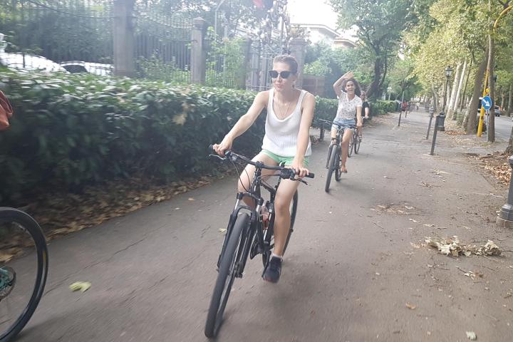 Waving during a bike tour in Italy